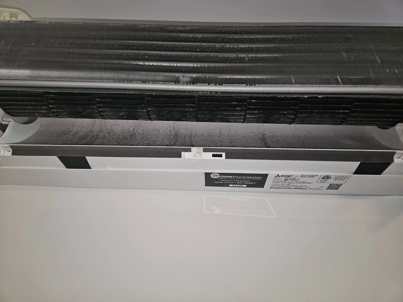Mold and dust on the blower wheel of a Mitsubishi MSZ-GL15NA in Chelmsford, MA before cleaning