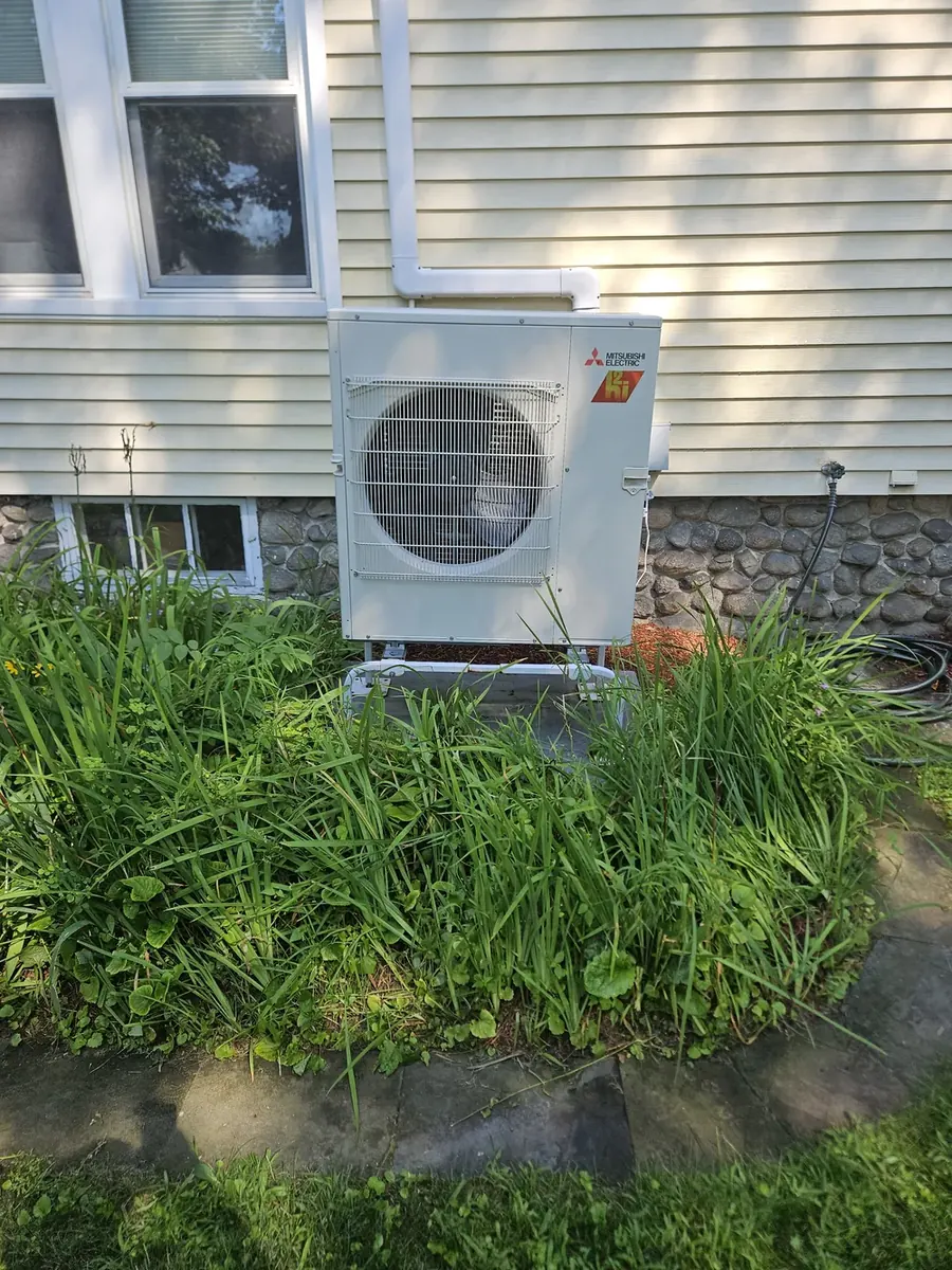 Mitsubishi H2i hyper-heat outdoor unit at a Chelmsford, MA home