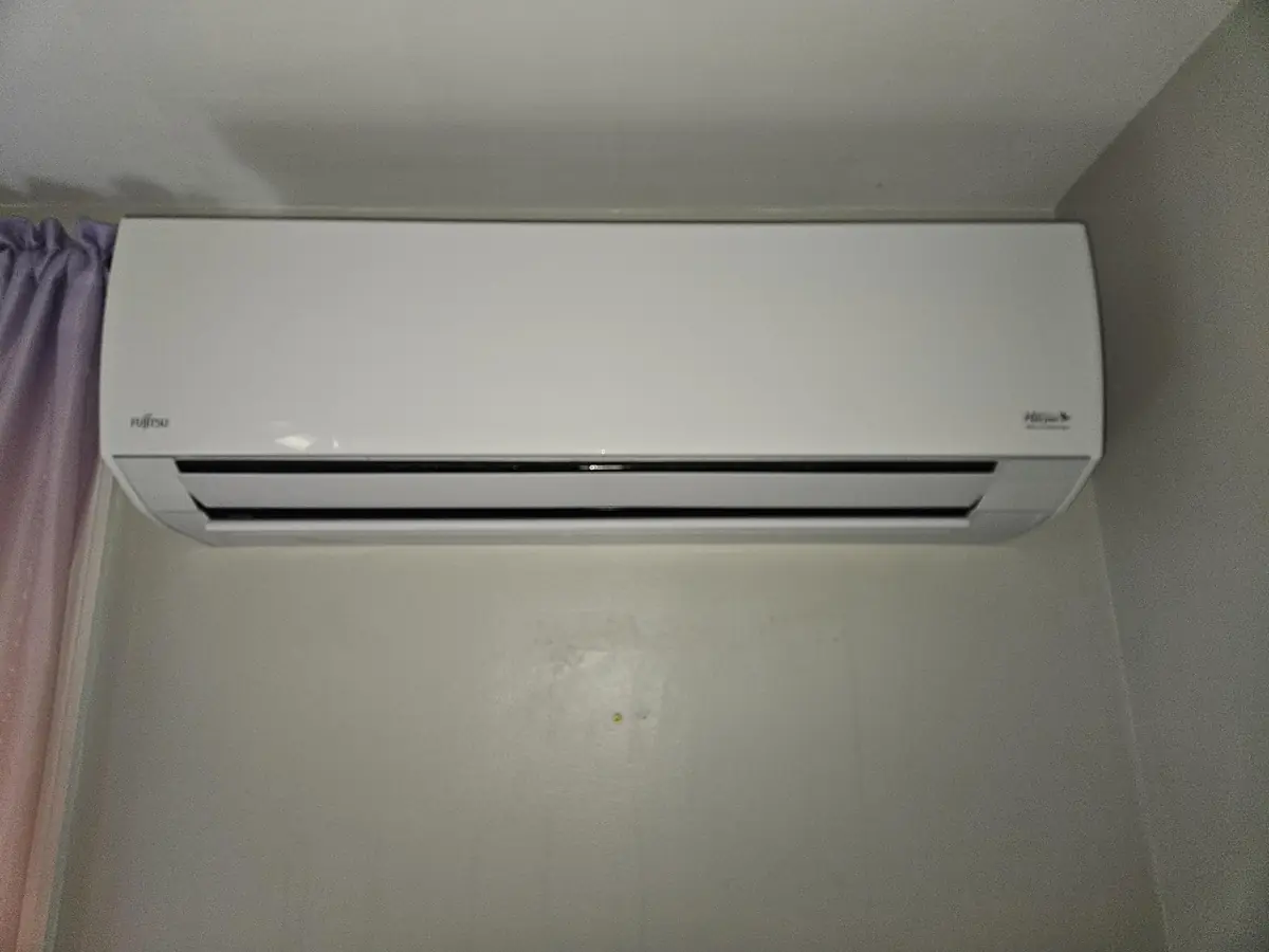 Clean Fujitsu mini-split head back together on the wall in a Cumberland, RI home