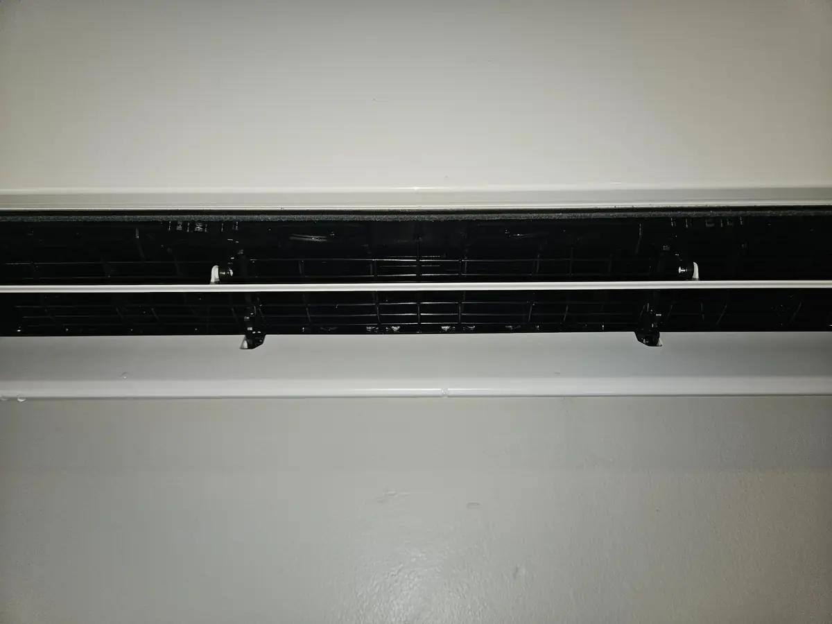 The same Fujitsu blower cage washed back to bare black plastic in Cumberland, RI