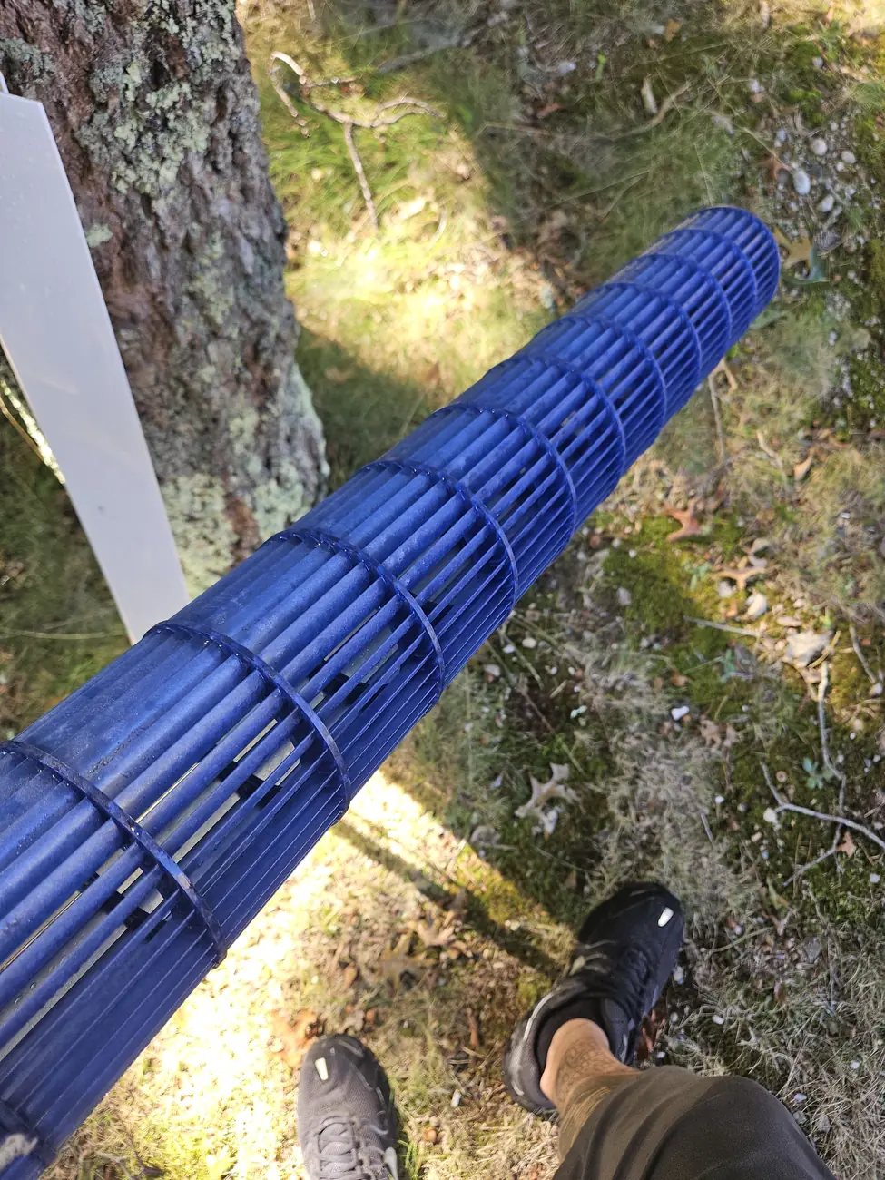 The same MRCOOL blower wheel after washing, clean blue fins visible, Falmouth MA