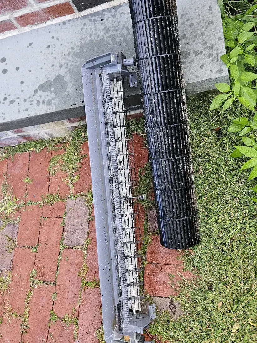 Blackened blower wheel and dirty drain pan removed from a Lexington MA mini-split