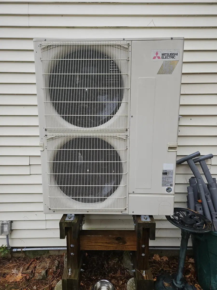 Mitsubishi multi-zone outdoor condenser serving three indoor heads at a Raymond, NH home