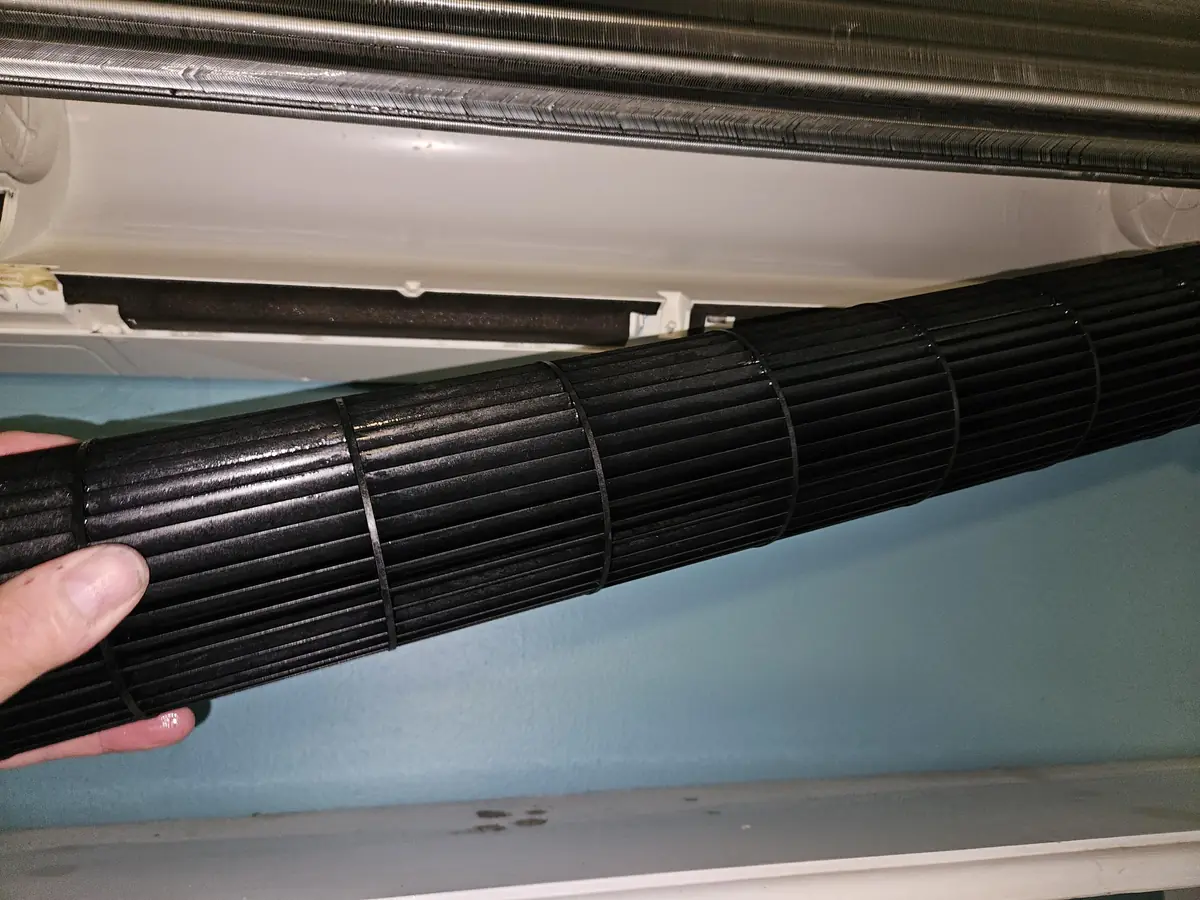 Blackened blower wheel removed from a Mitsubishi heat pump head in Raymond, NH
